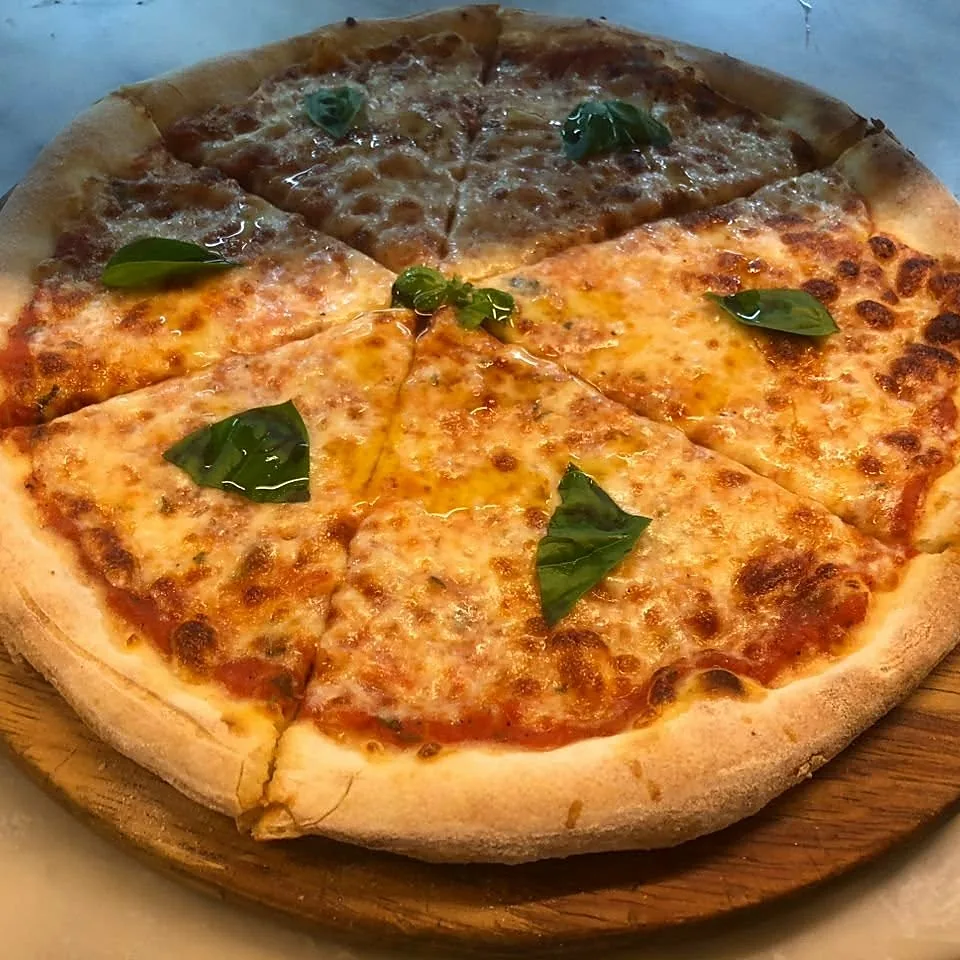 Margherita pizza on a wooden board